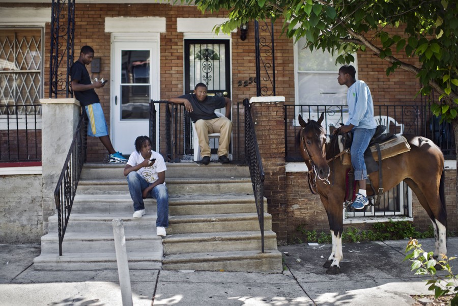 Tymeir Sanders, 17, stops by a friend´s house on West Harold Street while on a ride with Rosie on Sunday, June 1, 2014.