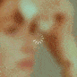 Gif of a loading circle on top of a woman's face