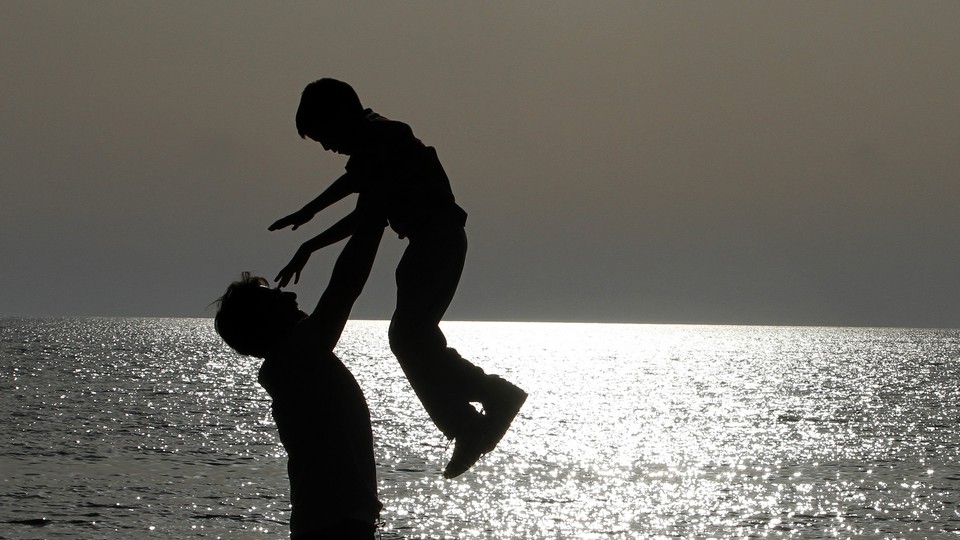 photograph of a family at the beach