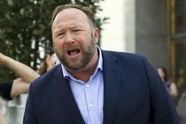 The conspiracy theorist Alex Jones speaks outside of the Dirksen Senate Office Building.