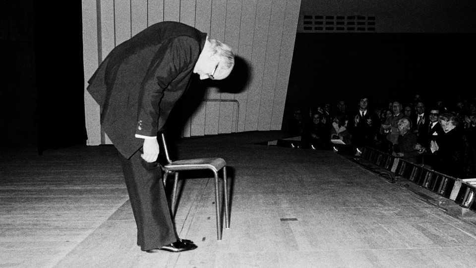 Photo of the Russian cellist Mstislav Rostropovich bowing on stage