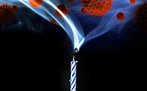 Virus particles appear in a plume of smoke coming out of a birthday candle.