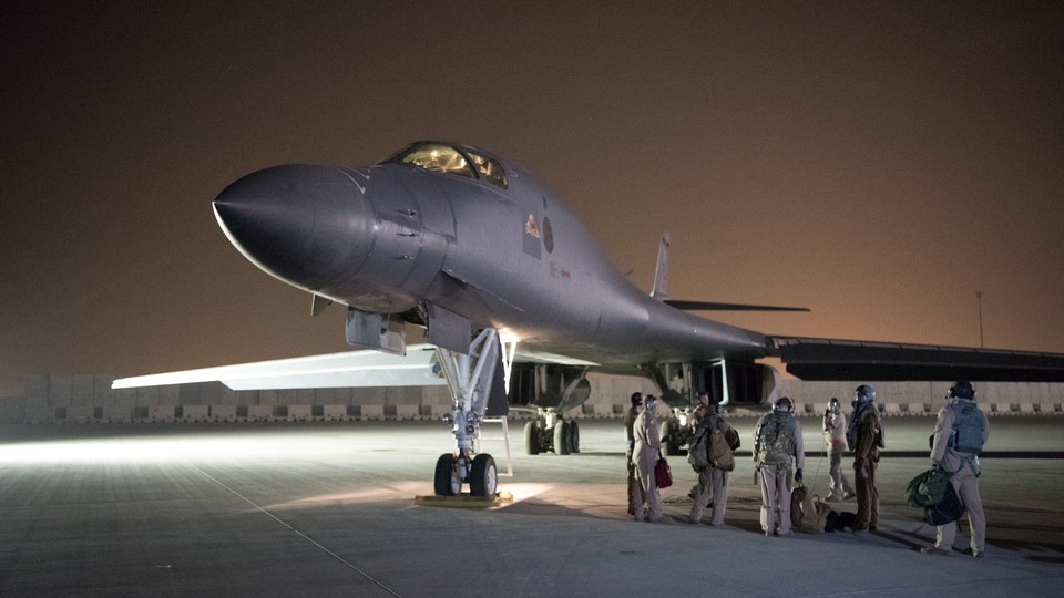 A U.S. Air Force flight crew leaves its base in Doha and prepares to strike Syria in response to its use of chemical weapons in April.