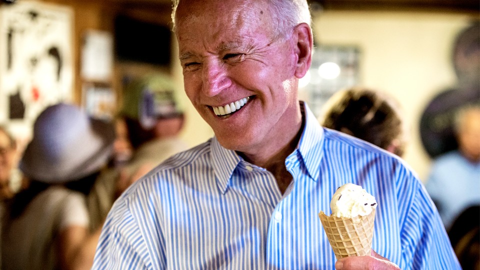 Biden grinning as he holds an ice-cream cone