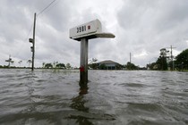 A mailbox is partially underwater after flooding in Big Lake, Louisiana, in June.