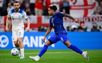 Weston McKennie of the U.S. controls the ball while England's Luke Shaw looks on
