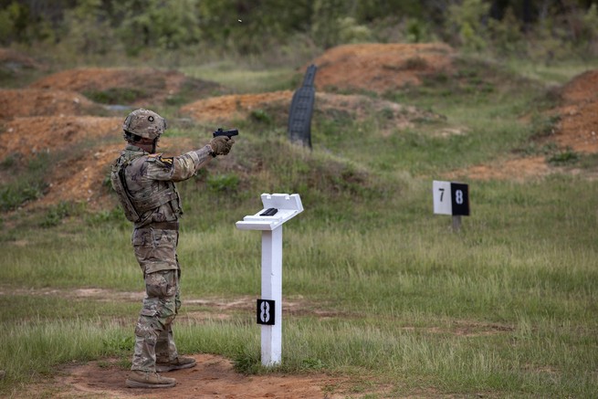 Cpt. Matthew Haas shoots at moving targets