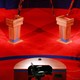 A photo of a red debate stage