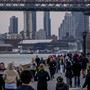 People run through crowds on the East River during the Coronavirus outbreak in New York City.