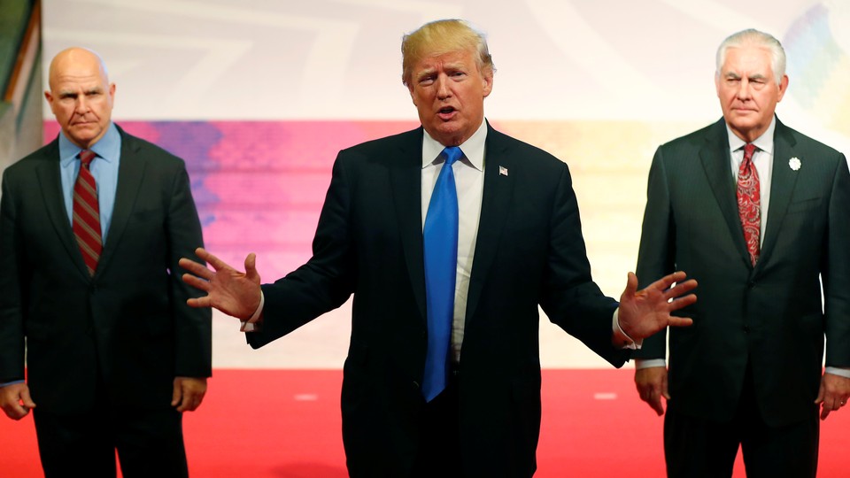 Donald Trump gestures with National Security Advisor H.R. McMaster and Secretary of State Rex Tillerson