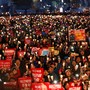 Protesters hold candles as they celebrate the impeachment of South Korea's ousted leader Park Geun Hye. 