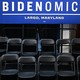 Chairs sitting in rows with a Bidenomics sign above them