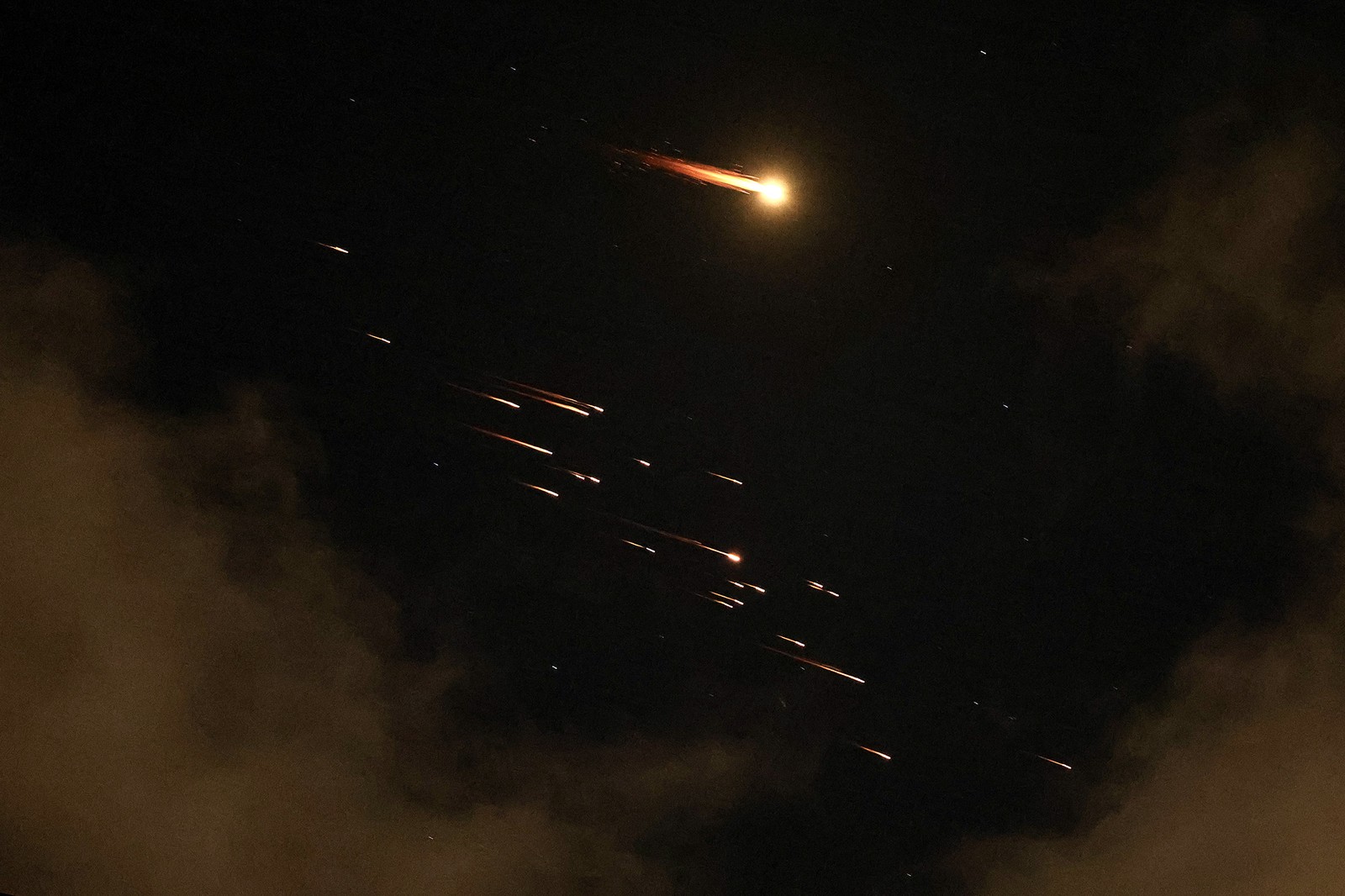 Missile trails streak through the sky above Israel.