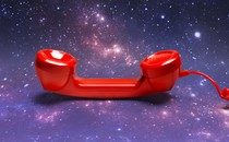 A red telephone receiver against a backdrop of stars and galaxies