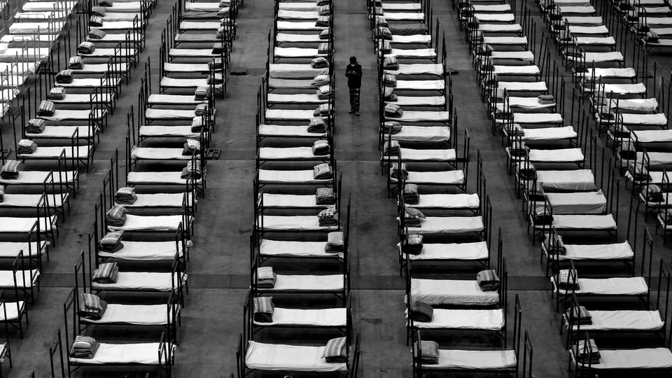 Cots lined up in a room