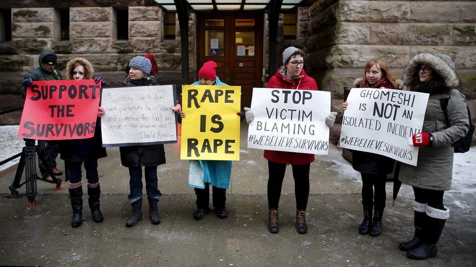 Protesters outside the court where Jian Ghomeshi was found not guilty on sexual assault charges, in Toronto on March 24, 2016.