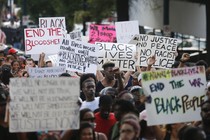 Demonstrators march through downtown Atlanta on July 8 to protest the shootings of black men by police officers.