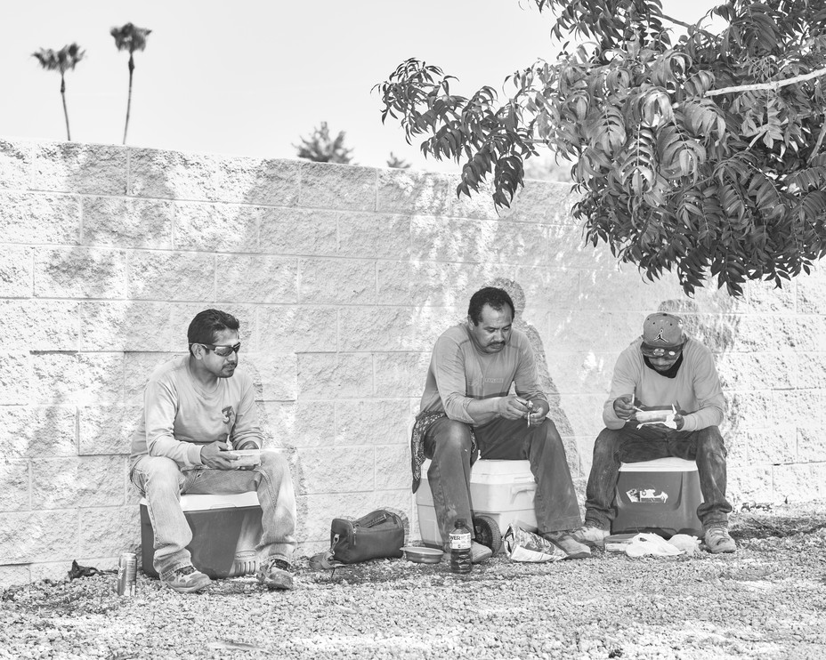 construction workers rest in the shade 