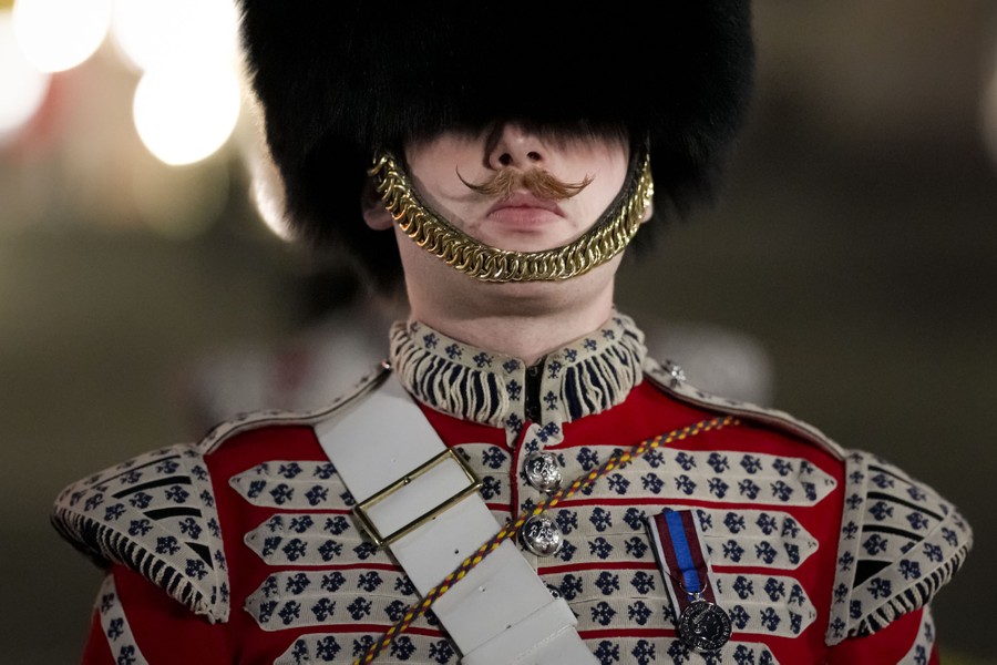 A British soldier wears an ornate dress uniform.