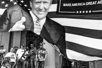 Armed protesters with a flag of Donald Trump