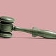 A gavel with a handle shaped like a bomb