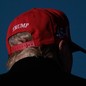 A photo of Donald Trump wearing a MAGA cap.