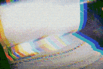 Highly pixelated gif of newspapers running through printing press