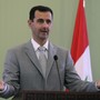 Syria's President Bashar al-Assad gestures as he speaks during a news conference with Turkey's Prime Minister Tayyip Erdogan, after their meeting in Damascus October 11, 2010. 