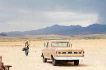 A still showing the Western landscape and a truck in the film "No Country for Old Men"