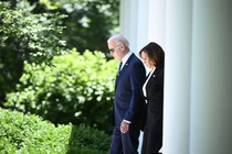 Biden and Harris step into the White House Rose Garden.