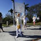 A teacher holds up an anti-gun sign. 