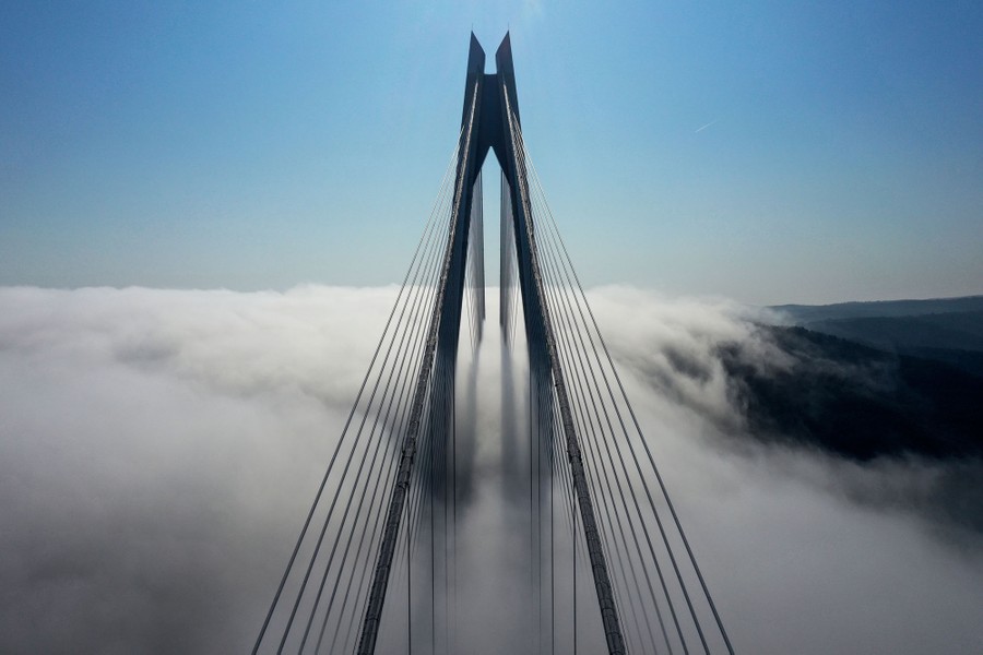 A tall bridge in a fog bank