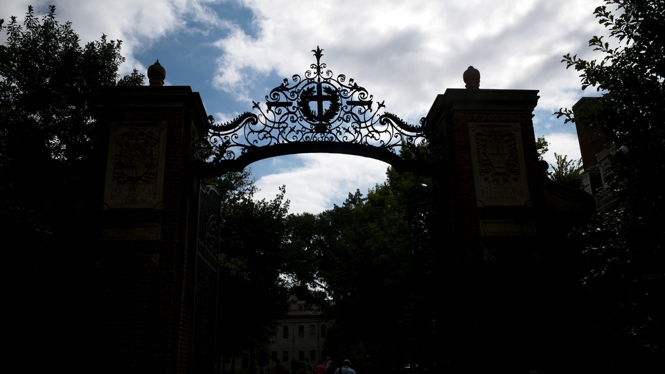 A general silhouette view of one of the many gates to the Harvard University campus