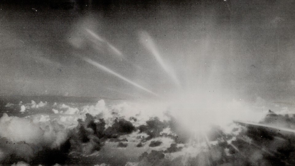 A black and white image of the sky with clouds