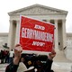 Demonstrators protest gerrymandering in front of the Supreme Court