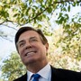 Paul Manafort is photographed smiling as he leaves the E. Barrett Prettyman United States Court House after being charged on October 30, 2017