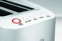 A Breville toaster with the "A Bit More" button
