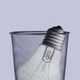 A lightbulb in a trash can