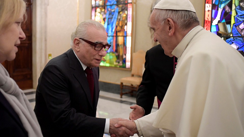 The filmmaker Martin Scorsese meets Pope Francis in a hall filled with stained glass in Rome in November.