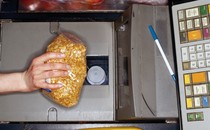 Photo of a bag of peanuts being scanned at checkout