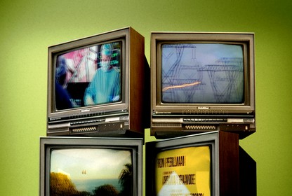 a set of TVs showing film clips about climate change