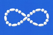An image of an infinity symbol made of pills