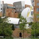 A woman walks through the MIT campus