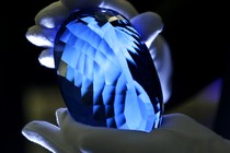 The largest known topaz stone, is held for photographing before it is made available to view at the Natural History Museum in London, on September 27, 2016.