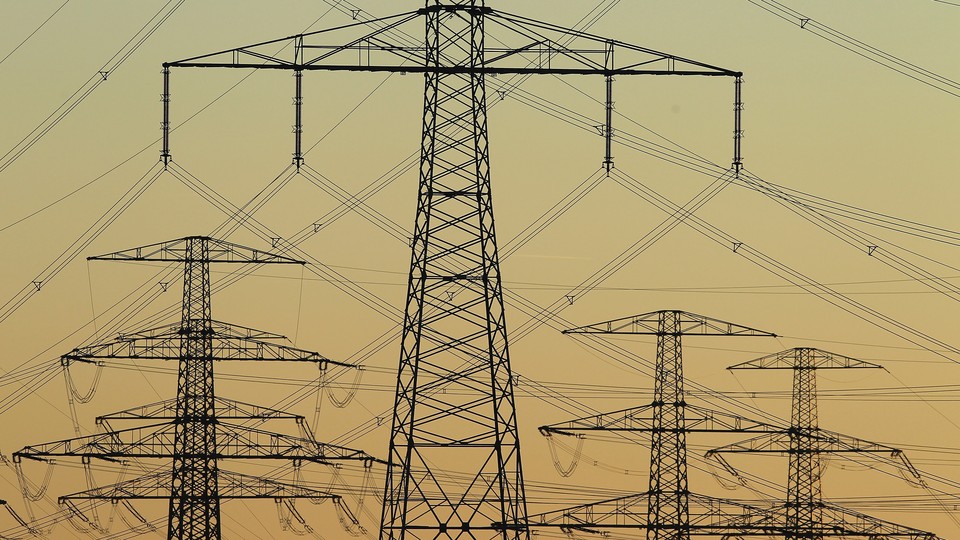 Electricity pylons stand at sunset on March 7, 2011 near Guestrow, Germany