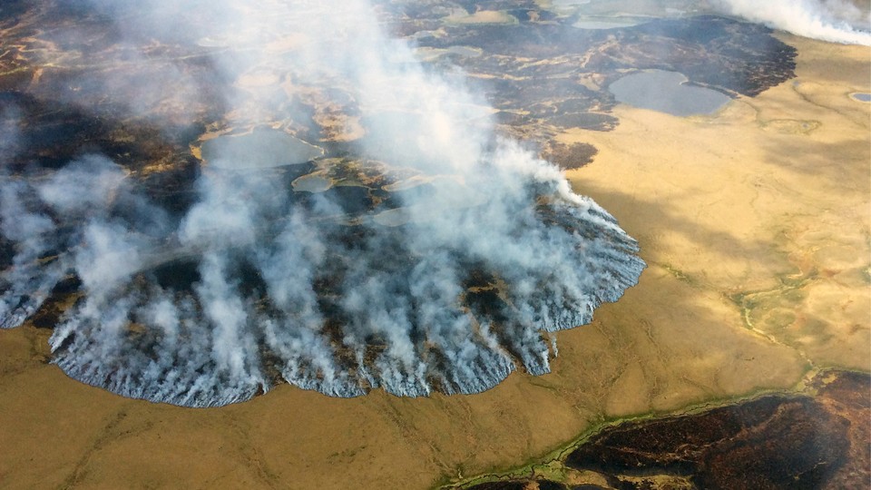 An aerial view of the Bogus Creek wildfire burning in Alaska's Yukon Delta National Wildlife Refuge