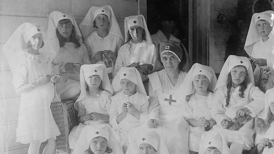 A historical photograph of Red Cross nurses