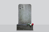 A tombstone in the shape of an iPhone