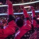 Trump rally-goers raise their fists