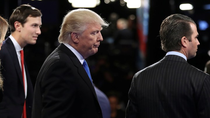 Donald Trump is flanked by his son-in-law, Jared Kushner, and his son Donald Trump Jr.